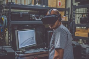 Man working with a virtual reality headset on