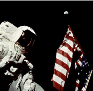 An Astronaut in space with an American Flag